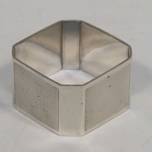 A very handsome and rare set of twelve Art Deco Sterling Silver napkin rings, having square bodies with chamfered corners and engine-turned engraving, all in their original cream and dark blue satin presentation box. This beautiful set of twelve silver napkin rings were made by Richard Richardson (poss.) of Birmingham in 1935. The dimensions of these fine hand-made and heavy Art Deco silver napkin rings are length 5 cms (2 inches) square, and they weigh a total of approx. 508g (16.4 troy ounces). Please note that these items are numbered 1 to 12.