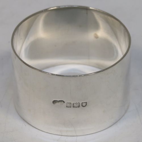 A very handsome Antique Sterling Silver set of six napkin rings, having plain round bodies with straight sides, all in their original maroon satin and velvet-lined presentation box. Made by Goldsmiths and Silversmiths of London in 1912. The dimensions of these fine hand-made antique silver napkin rings are diameter 4.5 cms (1.75 inches), height 3 cms (1.25 inches), and they weigh a total of approx. 285g (9.2 troy ounces).