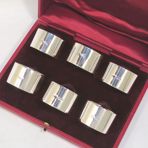 A very handsome Antique Sterling Silver set of six napkin rings, having plain round bodies with straight sides, all in their original maroon satin and velvet-lined presentation box. Made by Goldsmiths and Silversmiths of London in 1912. The dimensions of these fine hand-made antique silver napkin rings are diameter 4.5 cms (1.75 inches), height 3 cms (1.25 inches), and they weigh a total of approx. 285g (9.2 troy ounces).