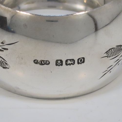 A set of six Antique Sterling Silver napkin rings, having round bellied bodies with hand-engraved floral decoration surrounding vacant cartouches, all in their original light blue satin-lined presentation box. This beautiful set of silver napkin rings were made by Joseph Gloster of Birmingham 1913. The dimensions of these fine hand-made antique silver napkin rings are diameter 5 cms (2 inches), height 2.5 cms (1 inch), and they weigh a total of approx. 107g (3.5 troy ounces).