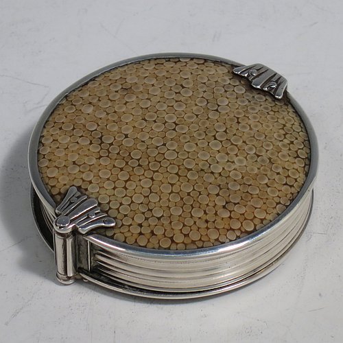 A rare Antique Sterling Silver and Shagreen magnifying glass, having a round body with pull-out and hinged magnifier, with hand-chased reeded borders, and green Shagreen covers. Made by Samuel Jacob of London in 1911. The dimensions of this fine hand-made antique silver and Shagreen magnifying glass and holder are diameter 5 cms (2 inches), length fully unfolded 11 cms (4.3 inches), and depth 1.5 cms (0.5 inch).