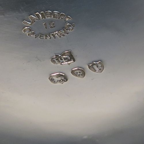 A very unusual Antique Victorian Sterling Silver copy of a bedchamber pot, having a plain bellied body, and a scroll side-handle. This handsome antique silver bedchamber pot bowl was made by Lamberts of London in 1890. The dimensions of this fine hand-made antique silver chamber pot are diameter 11 cms (4.25 inches), height 6 cms (2.3 inches), and it weighs approx. 140g (4.5 troy ounces).