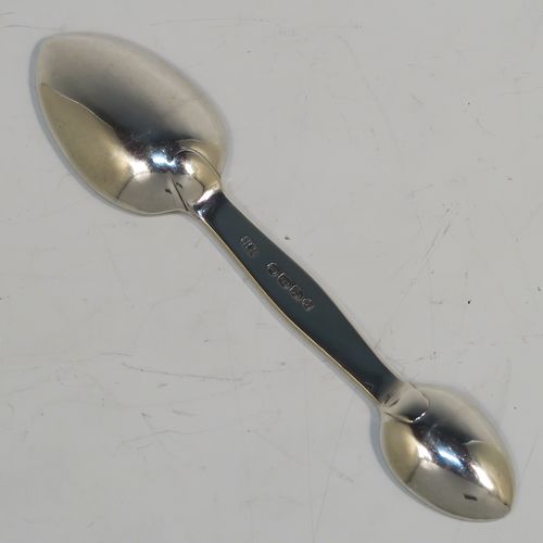 A rare Antique Victorian Sterling Silver double bowled medicine spoon, having a very plain body with oval bowls. This elegant antique silver double-bowled medicine spoon was made by Henry Holland of London in 1870. The dimensions of this fine hand-made antique silver medicine spoon are length 13.5cms (5.3 inches), and it weighs approx. 29g (0.9 troy ounces).