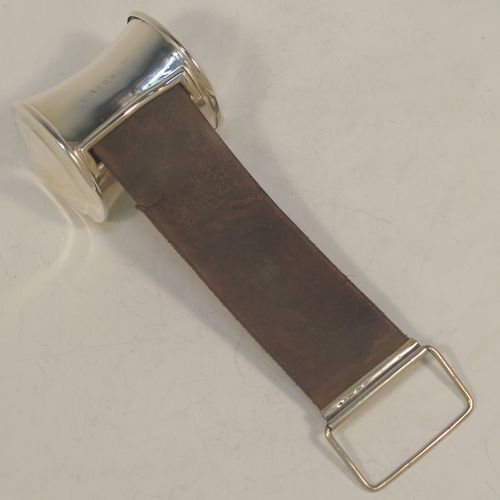 A very handsome and rare Antique Edwardian Sterling Silver and leather shaving cut-throat razor sharpening strop, having a plain cylindrical body with concave sides, a ring carrying handle, and an extendable leather strap with a rectangular hanging loop. Made in Birmingham in 1907. The dimensions of this fine hand-made antique silver and leather cut-throat razor shaving strop are height 32.5 cms (12.75 inches), and diameter at base 11.5 cms (4.5 inches). Please note that the leather strap is slightly damaged with a one cm long cut near the hanging loop.