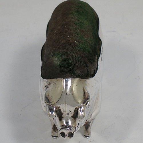 A handsome and unusually large Antique Edwardian Sterling Silver pin cushion, in the form of a pig with a dark green velvet covered pin cushion along its back. Made by Levi and Salaman of Birmingham in 1903. The dimensions of this fine hand-made antique silver Pig pin cushion are length 6 cms (2.3 inches), width 3 cms (1.25 inches), an height 5.5 cms (2.25 inches). Please note that the green velvet is discoloured.