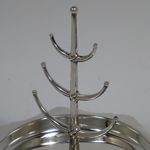 An Antique Sterling Silver ring tree, having a central plain tree for rings attached to a round body with an applied shaped border, and sitting on a flat base. Made by Synter and Beddoes of Birmingham in 1913. The dimensions of this fine hand-made antique silver ring tree are height 10 cms (4 inches), diameter 11 cms (4.25 inches), and it weighs approx. 81g (2.6 troy ounce).    