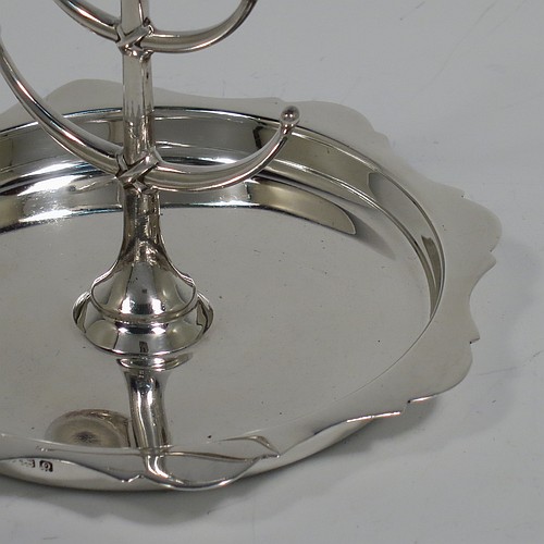 An Antique Sterling Silver ring tree, having a central plain tree for rings attached to a round body with an applied shaped border, and sitting on a flat base. Made by Synter and Beddoes of Birmingham in 1913. The dimensions of this fine hand-made antique silver ring tree are height 10 cms (4 inches), diameter 11 cms (4.25 inches), and it weighs approx. 81g (2.6 troy ounce).    