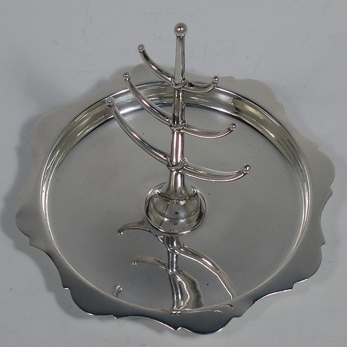 An Antique Sterling Silver ring tree, having a central plain tree for rings attached to a round body with an applied shaped border, and sitting on a flat base. Made by Synter and Beddoes of Birmingham in 1913. The dimensions of this fine hand-made antique silver ring tree are height 10 cms (4 inches), diameter 11 cms (4.25 inches), and it weighs approx. 81g (2.6 troy ounce).    