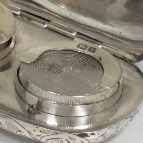 An Antique Edwardian Sterling Silver double Sovereign case, having a rectangular body with rounded corners and hand-engraved floral decoration, with a hinged lid, and internal sprung mechanisms which are in working order, and a push-button clasp with ring. All made by Samuel M. Levi of Birmingham in 1909. The dimensions of this fine hand-made antique silver sovereign case are length 6 cms (2.3 inches), width 3.5 cms (1.3 inches), and it weighs 36g (1.2 troy ounces).   