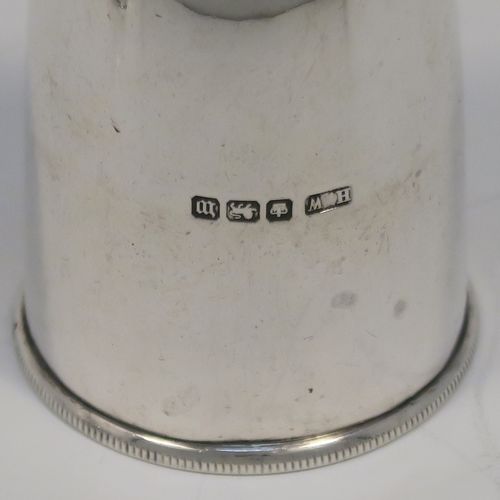 A very rare and handsome pair of Antique Sterling Silver Bullet case or cartridge pepper pots, having plain round bodies with pull-off Primer style flat bases. This elegant pair of silver Bullet style pepper pots were made on the eve of the First World War by Henry Wilkinson of Sheffield in 1914. The dimensions of this rare pair of Cartridge or Bullet pepper shakers are height 6 cms (2.25 inches), diameter at base 3.5 cms (1.3 inches), and they weigh a total of approx. 66g (2 troy ounce).