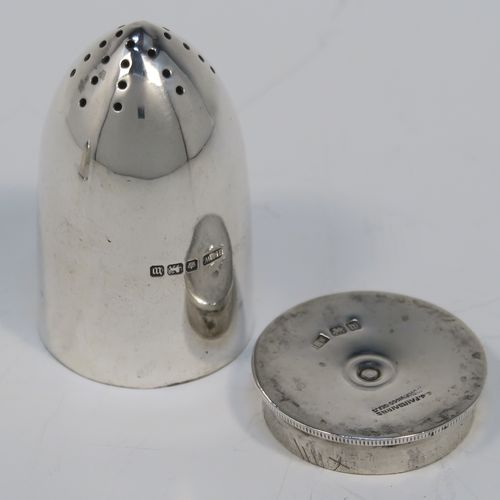 A very rare and handsome pair of Antique Sterling Silver Bullet case or cartridge pepper pots, having plain round bodies with pull-off Primer style flat bases. This elegant pair of silver Bullet style pepper pots were made on the eve of the First World War by Henry Wilkinson of Sheffield in 1914. The dimensions of this rare pair of Cartridge or Bullet pepper shakers are height 6 cms (2.25 inches), diameter at base 3.5 cms (1.3 inches), and they weigh a total of approx. 66g (2 troy ounce).