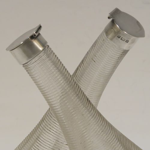 A very unusual and elegant Antique Edwardian Sterling Silver and crystal oil and vinegar tipper set, having plain round silver mounts on a hand-blown and cut crystal body. This beautiful oil and vinegar tipper set was made by William Sparrow of Birmingham in 1904. The dimensions of this fine hand-made vinegar and oil set are height 15 cms (6 inches), length 11.5 cms (4.5 inches), and width 6.5 cms (2.5 inches).