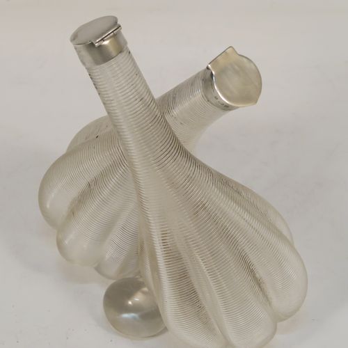 A very unusual and elegant Antique Edwardian Sterling Silver and crystal oil and vinegar tipper set, having plain round silver mounts on a hand-blown and cut crystal body. This beautiful oil and vinegar tipper set was made by William Sparrow of Birmingham in 1904. The dimensions of this fine hand-made vinegar and oil set are height 15 cms (6 inches), length 11.5 cms (4.5 inches), and width 6.5 cms (2.5 inches).