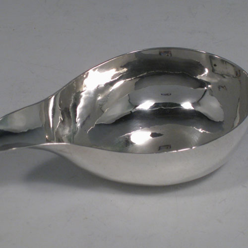 A rare Antique Georgian Sterling Silver pap boat, having a very plain oval unadorned body. This handsome antique silver pap boat was made in London in 1746. The dimensions of this fine hand-made antique silver pap boat are length 11 cms (4.25 inches), width 6.5 cms (2.5 inches), and it weighs approx. 45g (1.5 troy ounces).
