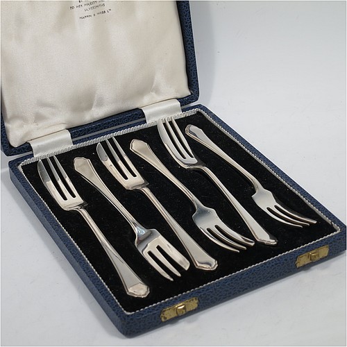 A handsome Sterling Silver set of six pastry forks, having single-struck Windsor pattern handles, and three tined forks, all in their original cream satin and black velvet-lined presentation box. Made by Mappin and Webb of Sheffield in 1935. The dimensions of these fine hand-made silver pastry forks are length 13.5 cms (5.25 inches), and they weigh a total of 129g (4.2 troy ounces).   