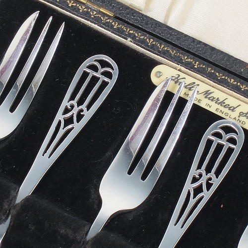 A very pretty and unusual Sterling Silver set of six pastry forks, having hand-pierced handles, and three tined forks, all in their original cream satin and black velvet-lined presentation box. Made by Angora Silver Co., of Birmingham in 1949. The dimensions of these fine hand-made silver pastry forks are length 13.5 cms (5.25 inches), and they weigh a total of 104g (3.4 troy ounces). Please note that the interior satin straps that cover the hinges are damaged.