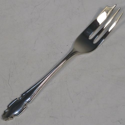A very handsome Sterling Silver set of six pastry forks, having Chippendale or Dubarry pattern handles, and three tined forks, all in their original cream satin and black velvet-lined presentation box. Made by the Cooper Brothers of Sheffield in 1935. The dimensions of these fine hand-made silver pastry forks are length 13 cms (5.25 inches), and they weigh a total of 132g (4.3 troy ounces). Please note that the box is in good overall condition, and the lid closes properly, but the whole box is slightly warped.