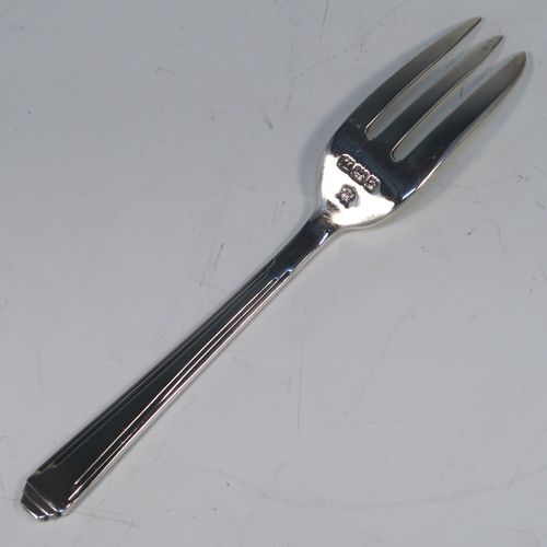 A very elegant Sterling Silver set of six pastry forks in an Art Deco style pattern, with three tined forks, all in their original cream satin and black velvet-lined presentation box. These handsome silver pastry forks were made by the Barker Brothers of Birmingham in 1935. The dimensions of this fine set of hand-made silver pastry forks are length 13 cms (5 inches), and they weigh a total of 136g (4.4 troy ounces).