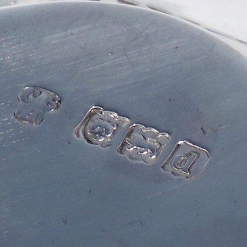 A very pretty Antique Victorian Sterling Silver pen tray, having an oval body, an applied bead border with bands of hand-engraved and hand-pierced geometrical decoration, and sitting on a flat base. Made by Charles Stuart Harris of London in 1899. The dimensions of this fine hand-made antique silver pen tray are length 27 cms (10.5 inches), width 10 cms (4 inches), and it weighs approx. 137g (4.4 troy ounces).