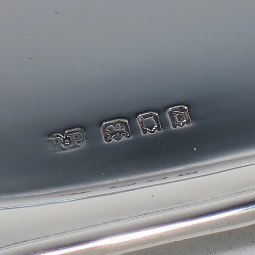 A very handsome Sterling Silver pen tray, having a rectangular body with a wavy raised edge and rounded corners, an applied reeded border, and a plain ground, sitting on a flat base. Made by Robert Pringle of London in 1919. The dimensions of this fine hand-made silver pen tray are length 24 cms (9.5 inches), width 10 cms (4 inches), and it weighs approx. 119g (3.8 troy ounces).