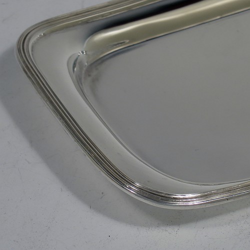 A very handsome Antique Victorian Sterling Silver pen tray, having a rectangular body with raised edge and rounded corners, an applied reeded border, and a plain ground, sitting on a flat base. Made by Charles Stuart Harris of London in 1895. The dimensions of this fine hand-made antique silver pen tray are length 21.5 cms (8.5 inches), width 9.5 cms (3.75 inches), and it weighs approx. 150g (4.8 troy ounces).