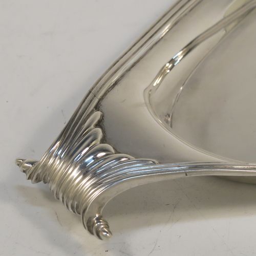 A very elegant Antique Victorian Sterling Silver pen tray, having a very plain oval body with applied reeded borders, cast scrolled handles at either end, and all sitting on a flat base. This beautiful antique silver pen tray was made by D. and J. Welby of London in 1893. The dimensions of this fine hand-made antique silver pen tray are length 23 cms (9 inches), width 10 cms (4 inches), and it weighs approx. 152g (4.9 troy ounces).