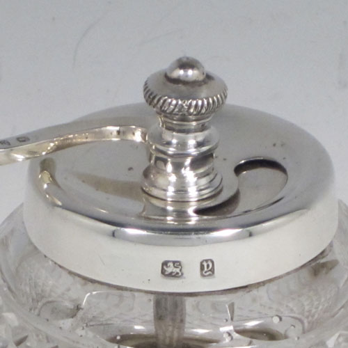 Antique Victorian sterling silver and hand-cut crystal pepper grinder, having a round body with hobnail-cut pattern, plain round mounts top and bottom, an opening for adding the pepper corns that is revealed by twisting the top mount, a side-winding grinder arm with ivory finial, and an original Peugeot grinding mechanism. Made in Birmingham in 1898. The dimensions of this fine hand-made silver and crystal pepper grinder are height 9 cms (3.5 inches), and diameter at base 6.5 cms (2.5 inches). 