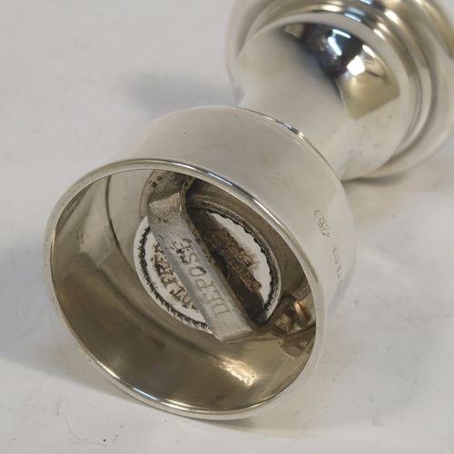 A handsome Sterling Silver pepper grinder, having a plain round baluster body, an original Peugeot grinder mechanism, and a knurled finial. This beautiful silver pepper grinder was made by Goldsmiths and Silversmiths of London in 1927. The dimensions of this fine hand-made silver pepper grinder are height 9 cms (3.5 inches), diameter at base 5 cms (2 inches), and it weighs approx. 96g (3 troy ounces).