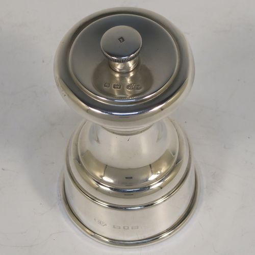 A handsome Sterling Silver pepper grinder, having a plain round baluster body, an original Peugeot grinder mechanism, and a knurled finial. This beautiful silver pepper grinder was made by Goldsmiths and Silversmiths of London in 1927. The dimensions of this fine hand-made silver pepper grinder are height 9 cms (3.5 inches), diameter at base 5 cms (2 inches), and it weighs approx. 96g (3 troy ounces).