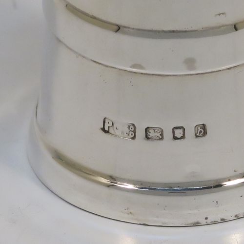 A very handsome Sterling Silver pepper grinder in a milk churn style, having a plain tapering straight sided body with three applied bands of decoration, with a knurled grinder finial, and a Peter Piper grinder mechanism. This elegant silver pepper grinder was made by Park Green and Co., of London in 1957. The dimensions of this fine hand-made silver pepper grinder are height 7.5 cms (3 inches), and diameter at base 4 cms (1.5 inches).