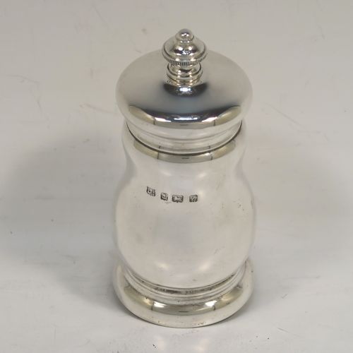 A handsome Antique Sterling Silver pepper grinder, having a plain round bellied body, an original Peugeot grinder mechanism, and a knurled round urn-shaped finial. This beautiful silver pepper grinder was made by S. W. Smith and Co., of Birmingham in 1924. The dimensions of this fine hand-made antique silver pepper grinder are height 10 cms (4 inches), diameter 5 cms (2 inches), and it weighs approx. 125g (4 troy ounces).   