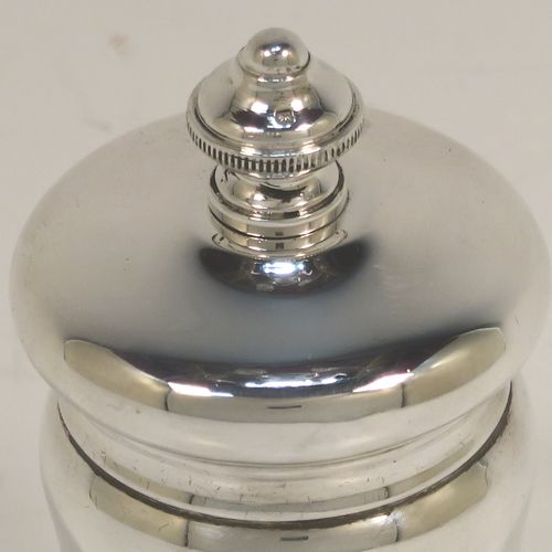 A handsome Antique Sterling Silver pepper grinder, having a plain round bellied body, an original Peugeot grinder mechanism, and a knurled round urn-shaped finial. This beautiful silver pepper grinder was made by S. W. Smith and Co., of Birmingham in 1924. The dimensions of this fine hand-made antique silver pepper grinder are height 10 cms (4 inches), diameter 5 cms (2 inches), and it weighs approx. 125g (4 troy ounces).
