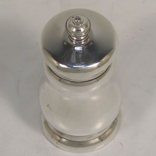 A handsome Antique Sterling Silver pepper grinder, having a plain round bellied body, an original Peugeot grinder mechanism, and a knurled round urn-shaped finial. This beautiful silver pepper grinder was made by S. W. Smith and Co., of Birmingham in 1924. The dimensions of this fine hand-made antique silver pepper grinder are height 10 cms (4 inches), diameter 5 cms (2 inches), and it weighs approx. 125g (4 troy ounces).