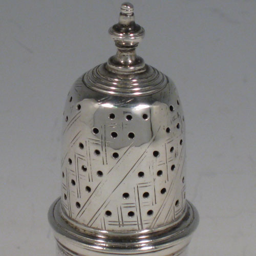 Antique Georgian sterling silver pepper pot, having a plain baluster body, a hand-pierced pull-off lid with finial, and sitting on a pedestal foot. Made by Thomas Bamford I of London in 1736. The dimensions of this fine hand-made silver pepper pot are height 13.5 cms (5.3 inches), diameter of main body 4.5 cms (1.75 inches), and it weighs approx. 101g (3.3 troy ounces).