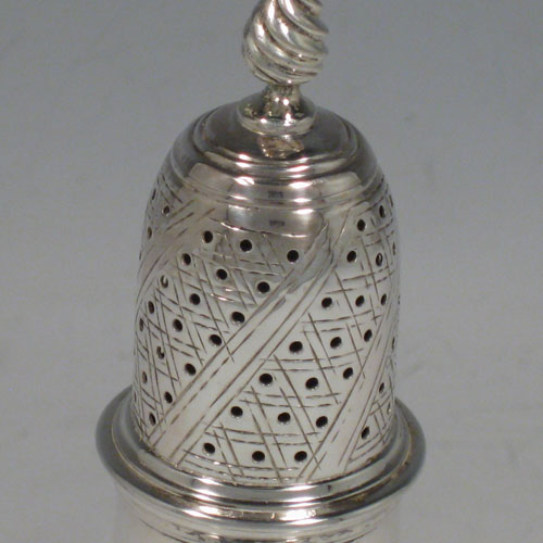 Antique Georgian sterling silver pepper pot, having a plain baluster body with a band of floral engraving and vacant laurel-leaf cartouche, a hand-pierced pull-off lid with swirl finial, and sitting on a pedestal foot with matching engraving. Made in London in 1771. The dimensions of this fine hand-made silver pepper pot are height 14 cms (5.5 inches), diameter of main body 5 cms (2 inches), and it weighs approx. 98g (3.2 troy ounces).