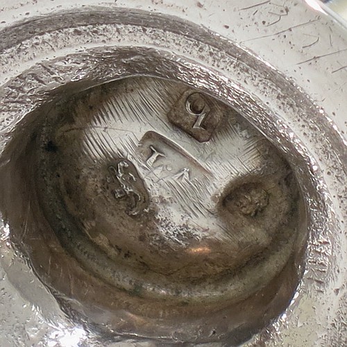A very handsome Antique Georgian George III Sterling Silver pepper pot, having a baluster body with hand-chased fluted and floral decoration, applied rope-twist borders, a hand-pierced pull-off lid with urn finial, and sitting on a pedestal foot. Made by William Turton of London in 1777. The dimensions of this fine hand-made antique silver pepper pot are height 15 cms (6 inches), diameter of main body 6 cms (2.25 inches), and it weighs approx. 142g (4.6 troy ounces).