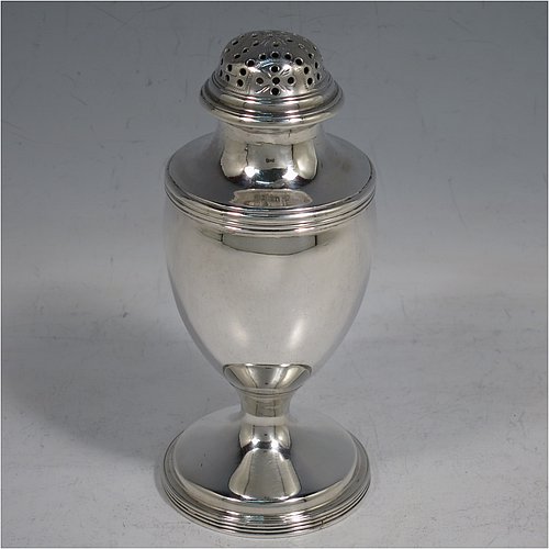 An Antique Georgian George III Sterling Silver bun style pepper pot, having a plain round body with applied reeded borders, a hand-pierced pull-off domed lid, and sitting on a pedestal foot. Made by Henry Green of London in 1794. The dimensions of this fine hand-made antique silver pepper pot are height 13 cms (5 inches), diameter of main body 5 cms (2 inches), and it weighs approx. 164g (5.3 troy ounces).    