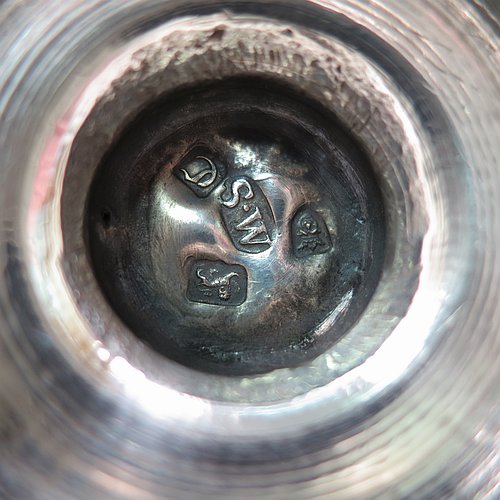 An Antique Georgian George II Sterling Silver pepper pot, having a plain baluster body with applied reeded borders, a hand-pierced pull-off lid with urn-shaped finial, and sitting on a pedestal foot. Made by Samuel Woods of London in 1758. The dimensions of this fine hand-made antique silver pepper pot are height 15 cms (6 inches), diameter of main body 5 cms (2 inches), and it weighs approx. 131g (4.2 troy ounces).