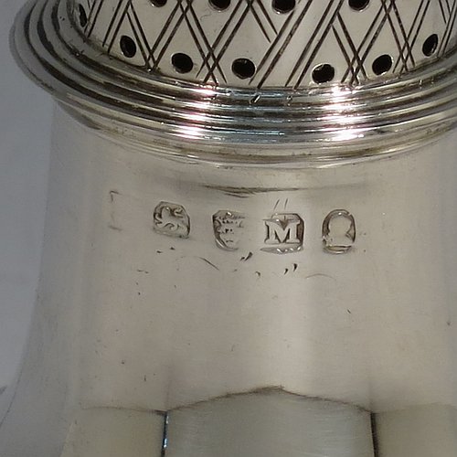 An Antique Georgian George II Sterling Silver pepper pot, having a plain bellied body with applied reeded borders, a hand-pierced pull-off lid with urn-shaped finial, and sitting on a pedestal foot. Made by Peter & William Bateman of London in 1807. The dimensions of this fine hand-made antique silver pepper pot are height 15 cms (6 inches), diameter of main body 5 cms (2 inches), and it weighs approx. 93g (3 troy ounces).