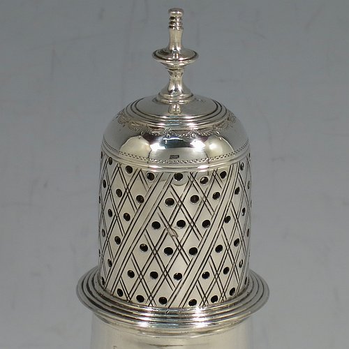 An Antique Georgian George II Sterling Silver pepper pot, having a plain bellied body with applied reeded borders, a hand-pierced pull-off lid with urn-shaped finial, and sitting on a pedestal foot. Made by Peter & William Bateman of London in 1807. The dimensions of this fine hand-made antique silver pepper pot are height 15 cms (6 inches), diameter of main body 5 cms (2 inches), and it weighs approx. 93g (3 troy ounces).