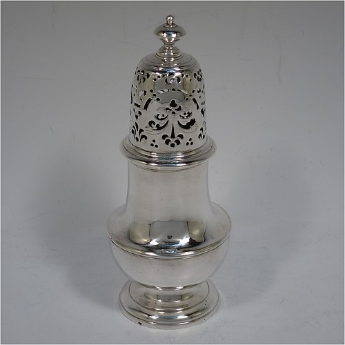 A very handsome Antique Georgian George I Sterling Silver heavy pepper pot caster, having a plain bellied body with applied and hand-chased reeded borders, a pull-off hand-pierced lid with cast finial, all sitting on a stepped pedestal foot. Made by Samuel Welder of London in 1725. The dimensions of this fine hand-made antique silver pepper caster pot are height 16 cms (6.25 inches), width 6.5 cms (2.5 inches), and it weighs approx. 185g (6 troy ounces).    