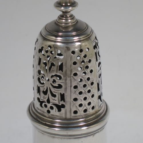 A very handsome Antique Georgian George II Sterling Silver pepper pot, having a plain baluster body with applied reeded borders, a hand-pierced pull-off lid with urn-shaped finial, and sitting on a pedestal foot. Made by Samuel Woods of London in 1749. The dimensions of this fine hand-made antique silver pepper pot are height 16 cms (6.25 inches), diameter of main body 6 cms (2.3 inches), and it weighs approx. 158g (5 troy ounces).