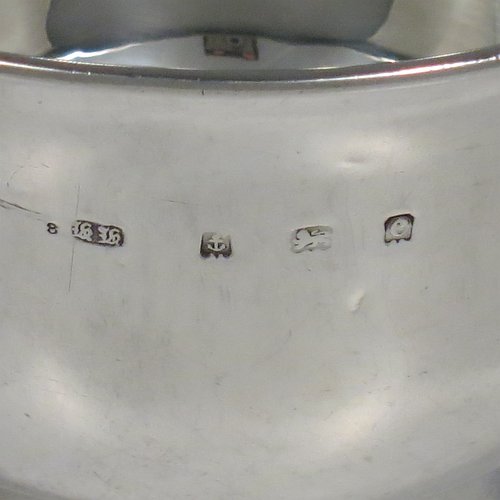 An Antique Edwardian Sterling Silver porringer, having a plain round baluster body, with two scroll side handles, and sitting on a collet foot. Made by Henry Hayes of Birmingham in 1902. The dimensions of this fine hand-made antique silver poringer are height 6.5 cms (2.5 inches), spread across arms 13 cms (5 inches), and it weighs approx. 125g (4 troy ounces).