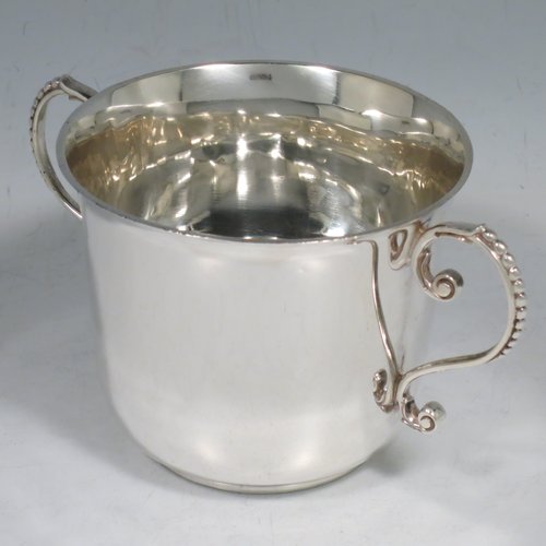 An Antique Victorian Sterling Silver porringer, having a plain round baluster body, two scroll side handles with beaded decoration, and sitting on a flat base. Made by Francis Higgins of London in 1897. The dimensions of this fine hand-made antique silver porringer are height 7.5 cms (3 inches), spread across arms 14 cms (5.5 inches), and it weighs approx. 163g (5.3 troy ounces).