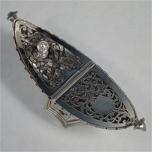 A very pretty Antique Sterling Silver pot pourri holder, or ecclesiastical Thurible incense burner, having an unusual boat-shaped body with a hand-pierced floral style cover, with one side hinged with a cast octagonal ball finial, two cast lambs-head side-handles, and all sitting on a spreading hexafoil pedestal foot. Made by Nathan and Hayes of Chester in 1912. The dimensions of this fine hand-made antique silver pot-pourri holder, or ecclesiastical Thurible incense burner, are length 19 cms (7.5 inches), width 6.5 cms (2.5 inches), height 8 cms (3 inches), and it weighs approx. 195g (6.3 troy ounces)