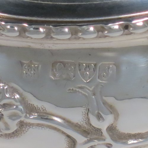 An Antique Edwardian Sterling Silver pot pourri holder, having a round bellied hand-body body with bird and floral decoration, a hinged lid with cast floral finial, and an internal pull-off pierced grill with ball finial, all sitting on a pedestal foot. Made by Nathan & Hayes of Chester in 1909. The dimensions of this fine hand-made antique silver pot-pourri holder are diameter 9 cms (3.5 inches), height 11 cms (4.3 inches), and it weighs approx. 157g (6 troy ounces).