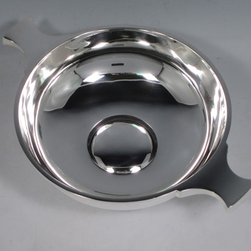 Antique Sterling Silver large Quaich, having a very plain round body, with two traditional handles, and sitting on a collet foot. This beautiful sterling silver quaich was made by Martin and Hall of Sheffield in 1911. The dimensions of this fine hand-made silver quaich are diameter 17.5 cms (7 inches), height 6 cms (2.25 inches), and it weighs approx. 371g (12 troy ounces).