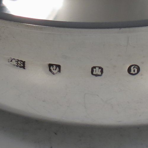 An Antique Victorian Sterling silver Scottish quaich, having a very plain round body, with two side handles, sitting on a collet foot. Made by Brook & Son of Edinburgh in 1889. The dimensions of this fine hand-made antique silver quaich are diameter of body 11 cms (4.25 inches), height 4 cms (1.5 inches), and it weighs approx. 145g (4.7 troy ounces).