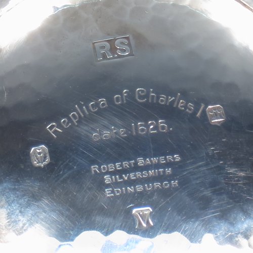 A Sterling Silver large Scottish quaich (being a replica of a Charles I example dated 1626), having a very plain round body with hand-hammered finish, with two side handles, and sitting on a collet foot. Made by Robert Sawers of Edinburgh in 1926. The dimensions of this fine hand-made silver quaich are diameter of body 15 cms (6 inches), height 5 cms (2 inches), and it weighs approx. 310g (10 troy ounces).