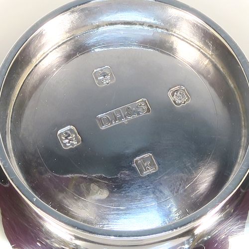 A handsome Scottish Sterling Silver Quaich, having a very plain round body, with two side handles, and sitting on a collet foot. This elegant silver Quaich was made by Davidson, Henderson, and Sorley of Glasgow in 1933. The dimensions of this fine hand-made silver Scottish Quaich are diameter of body 9 cms (3.5 inches), height 4 cms (1.5 inches), and it weighs approx. 116g (3.7 troy ounces).   